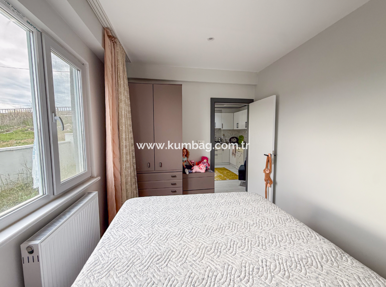 1 1 Wohnung Mit Garten In Einem Neuen Gebäude Auf Der Strandseite Der Strasse In Kumbağ